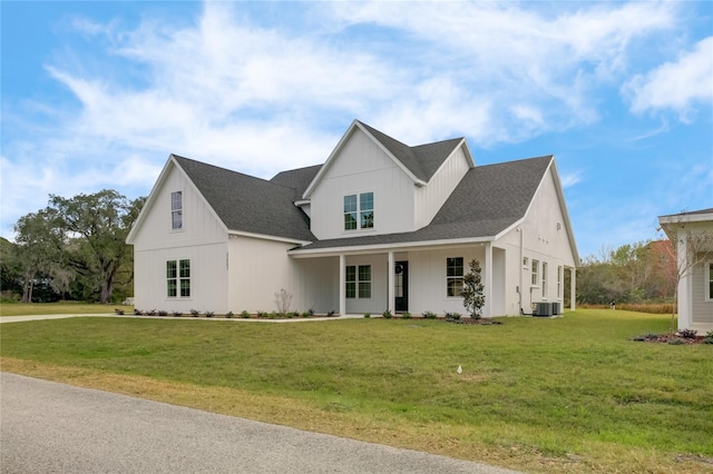 modern inspired farmhouse featuring a front yard and central air condition unit