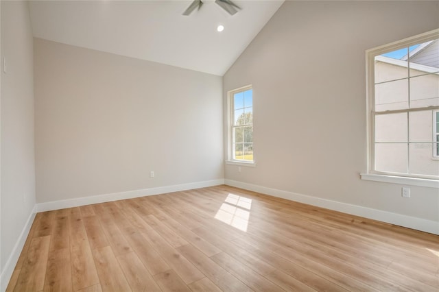 unfurnished room featuring high vaulted ceiling, light hardwood / wood-style floors, and ceiling fan