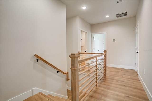 stairs with light wood-type flooring