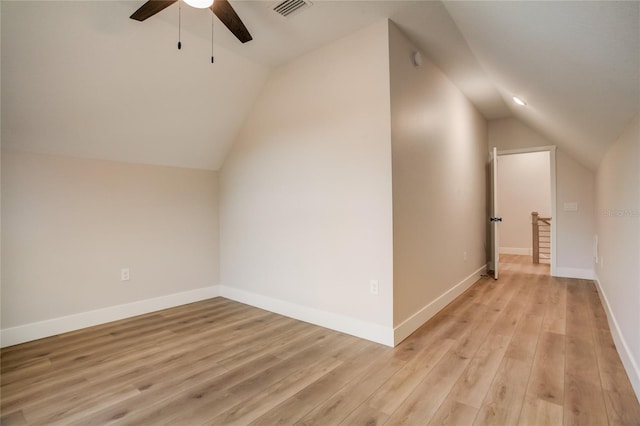 bonus room featuring ceiling fan, vaulted ceiling, and light wood-type flooring