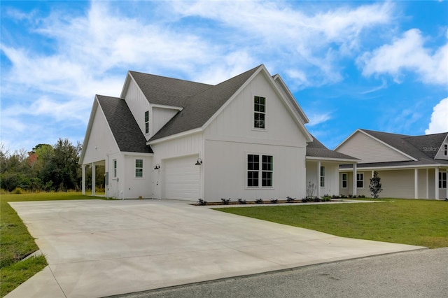 view of front of home with a front lawn and a garage