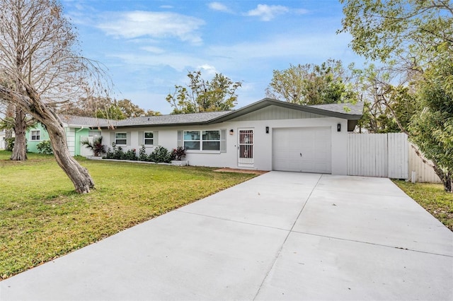 ranch-style home with a front yard and a garage