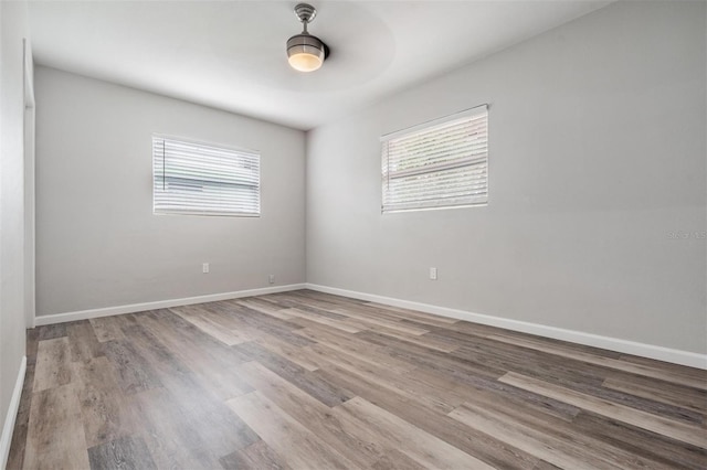 empty room featuring a healthy amount of sunlight and light wood-type flooring