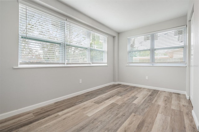 unfurnished room featuring light wood-type flooring