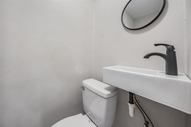 bathroom with sink and toilet