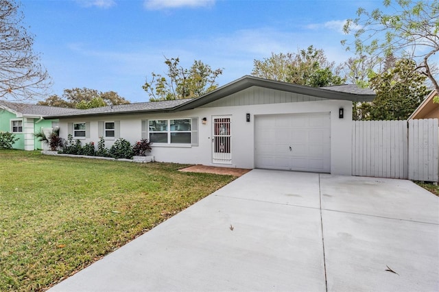 ranch-style home featuring a front yard and a garage