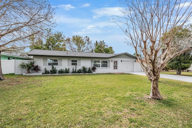 ranch-style home with a front lawn and a garage