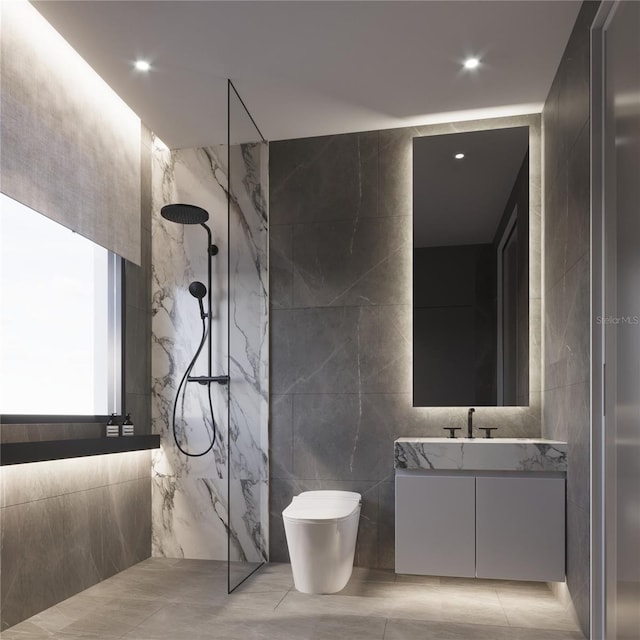 bathroom with tile walls, tile floors, vanity, and tiled shower