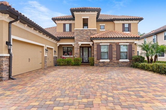 mediterranean / spanish-style home featuring a garage