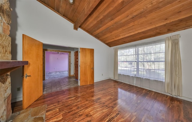 tiled empty room with a stone fireplace, wooden ceiling, and vaulted ceiling with beams