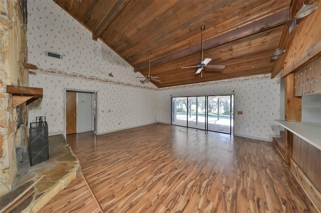 unfurnished living room with wooden ceiling, high vaulted ceiling, wood-type flooring, ceiling fan, and beam ceiling