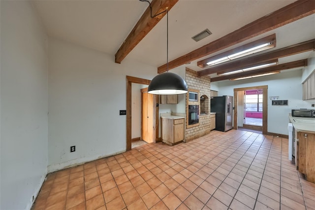 kitchen featuring brick wall, pendant lighting, light tile floors, stainless steel appliances, and beam ceiling