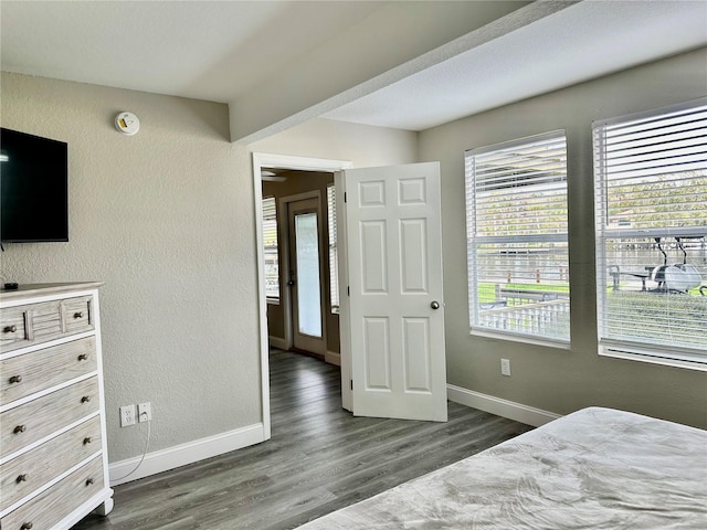 bedroom featuring dark wood-type flooring