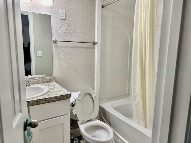 full bathroom with shower / bath combo, toilet, and vanity with extensive cabinet space