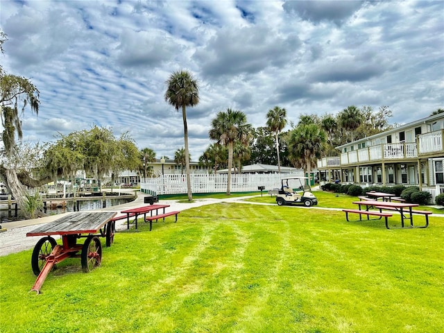 view of home's community with a lawn