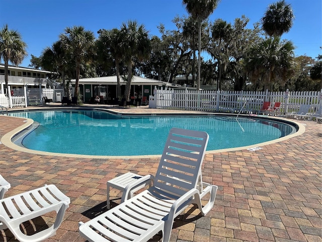 view of pool featuring a patio area