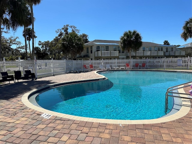 view of swimming pool with a patio area