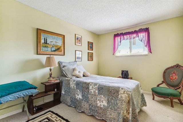 carpeted bedroom featuring a textured ceiling