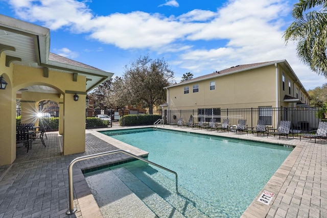 view of swimming pool featuring a patio area