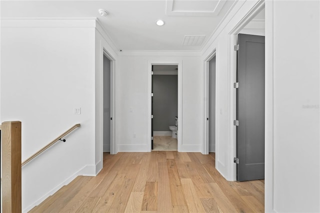 hallway featuring light hardwood / wood-style flooring and ornamental molding