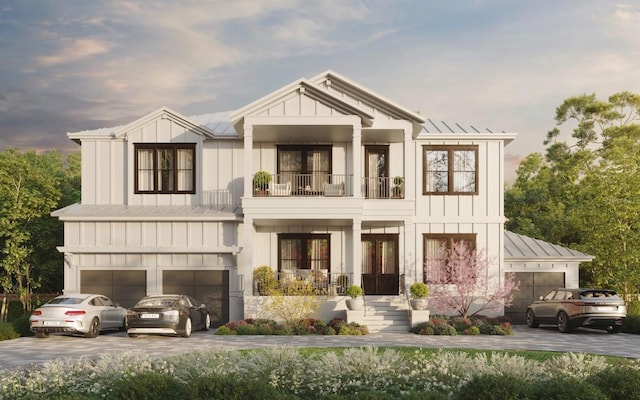 view of front of property with a garage and a balcony