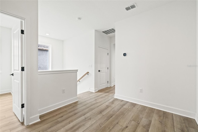 spare room featuring light hardwood / wood-style floors