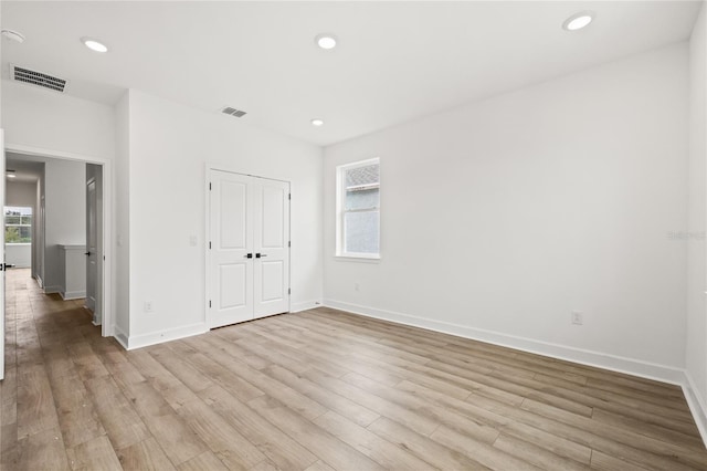 unfurnished bedroom featuring light wood-type flooring