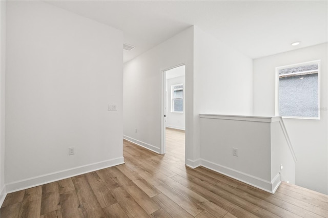 unfurnished room featuring hardwood / wood-style floors