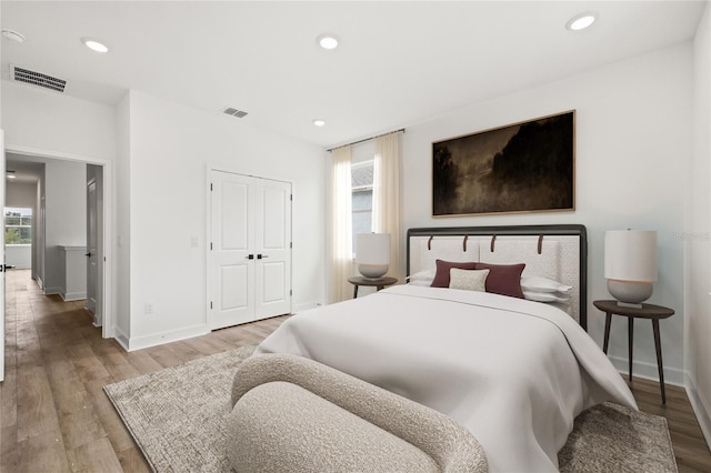 bedroom featuring a closet and light hardwood / wood-style flooring