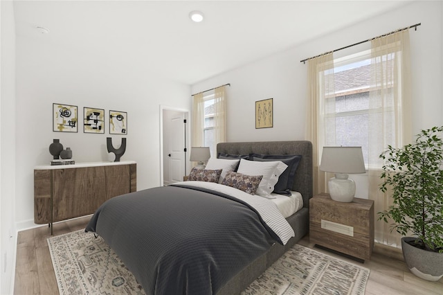 bedroom with light wood-type flooring