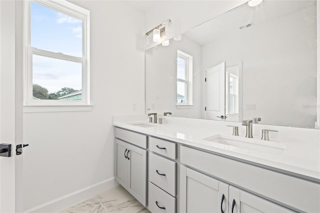 bathroom with vanity and a healthy amount of sunlight