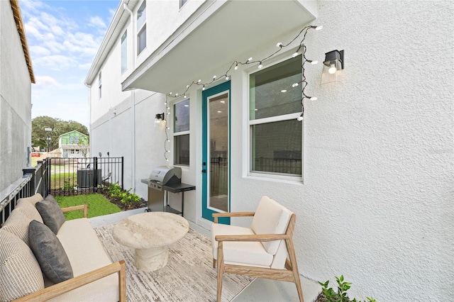 balcony featuring central AC unit and grilling area