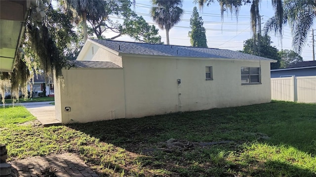 rear view of property featuring a yard