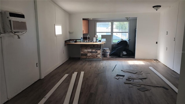 unfurnished living room with wood-type flooring