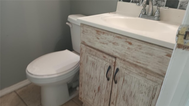 bathroom with tile patterned floors, toilet, and vanity