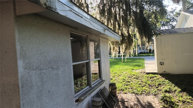 view of property exterior featuring a lawn