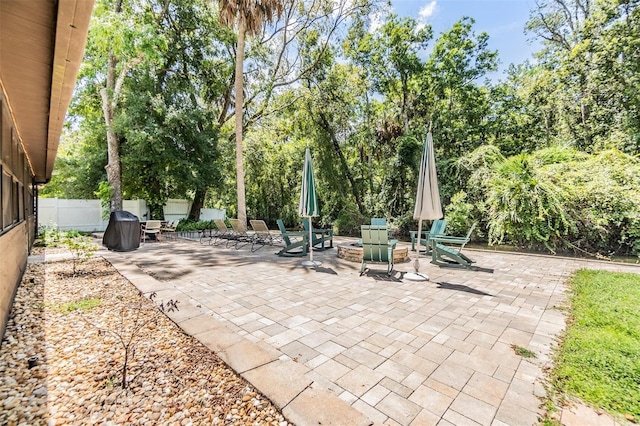 view of patio / terrace with an outdoor fire pit