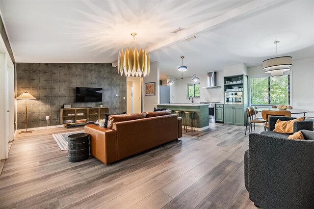 8952 W White Dogwood Dr, Homosassa, FL 34448 - living area with wood finished floors and a chandelier