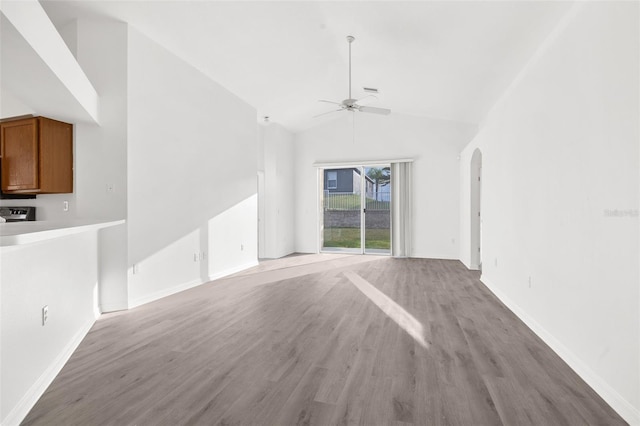 spare room featuring ceiling fan, light hardwood / wood-style flooring, and high vaulted ceiling