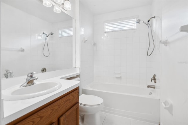 full bathroom with tile floors, large vanity, a healthy amount of sunlight, and tiled shower / bath