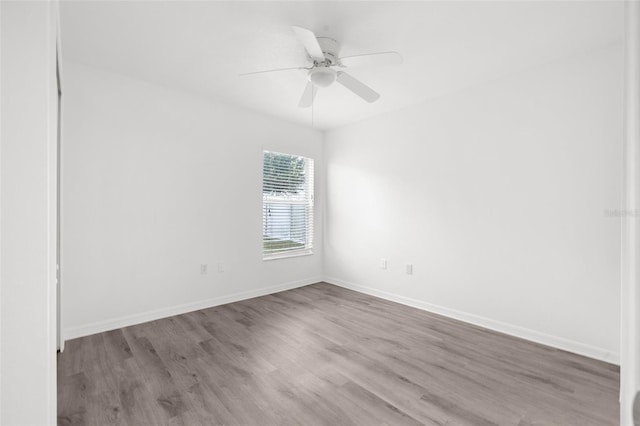 unfurnished room featuring light hardwood / wood-style floors and ceiling fan