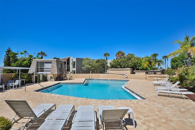 view of swimming pool with a patio