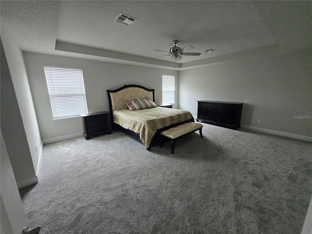 bedroom with visible vents, carpet flooring, and multiple windows