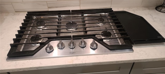 interior details featuring stainless steel gas stovetop