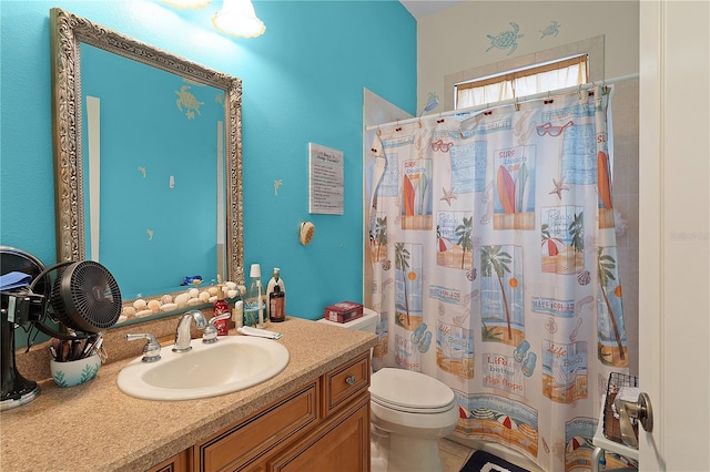 bathroom with toilet and vanity