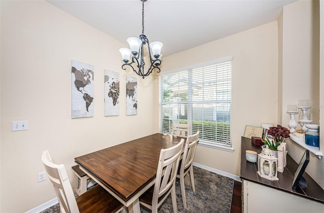 dining area featuring a chandelier