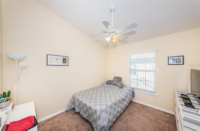 bedroom with ceiling fan, lofted ceiling, and carpet