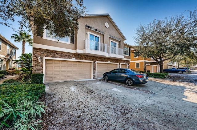 townhome / multi-family property featuring a garage