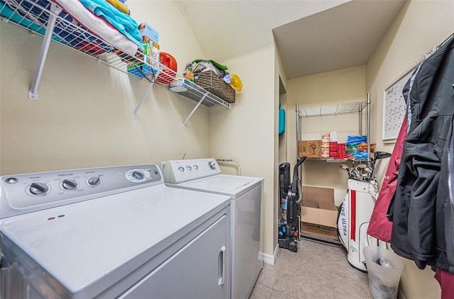 clothes washing area with washing machine and dryer