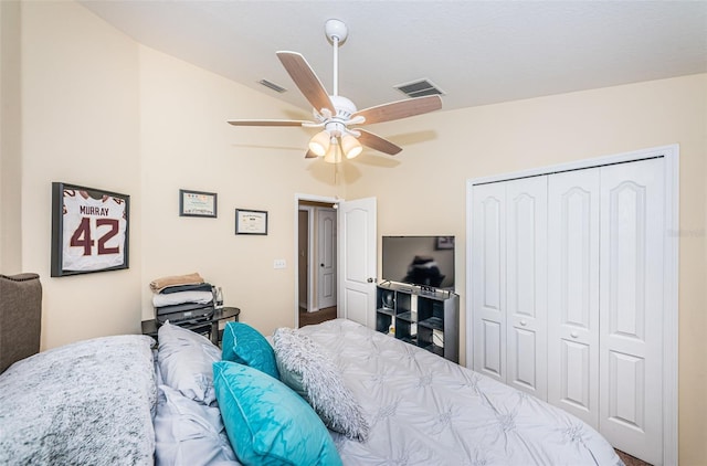 bedroom featuring vaulted ceiling, a closet, and ceiling fan